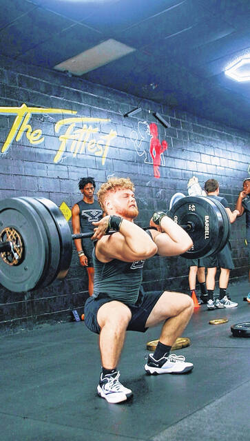 Eli Clinton power cleaning 250 lbs.
                                 Demarco Bostic | The Herald-Advocate