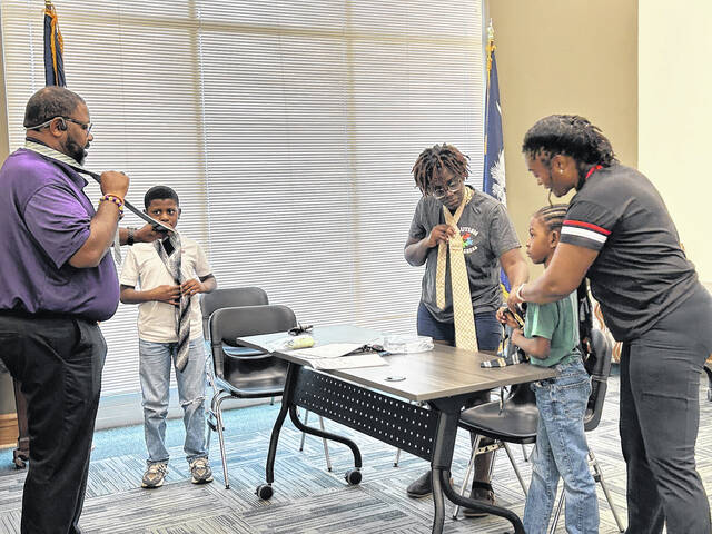 Learning to tie ties activity.
                                 Courtesy photo