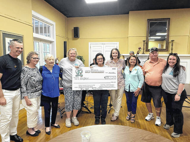 Hospice of Scotland County staff hold a ceremonial check symbolizing total funds raised during the May 6, 2026 golf tournament; $186,525.
                                 Travis Petty Jr. | Laurinburg Exchange