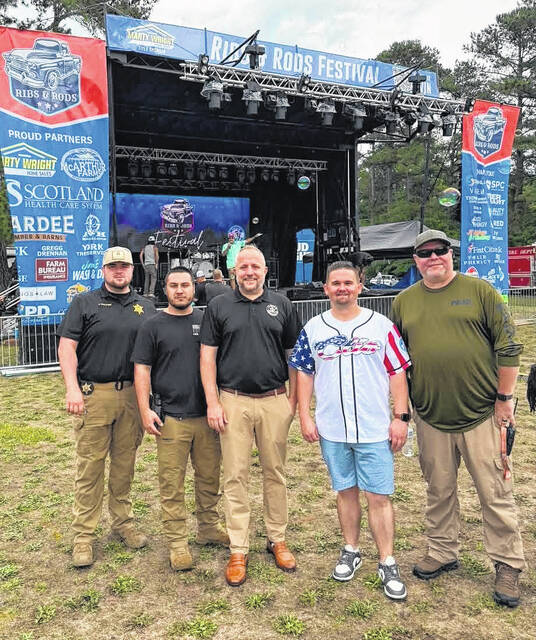 Congressman Russell Fry poses with Clio Mayor Adam Pate and distinguished members of the Marlboro County Sheriffs Office and the Clio Police Department